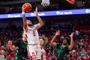 Nebraska Cornhusker guard C.J. Wilcher (0) makes a layup against the North Dakota Fighting Hawks in the second half during a college basketball game Wednesday, December 20, 2023, in Lincoln, Nebraska. Photo by John S. Peterson.
