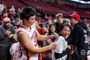 Nebraska Cornhusker guard Keisei Tominaga (30) signs a autograph after the win over the North Dakota Fighting Hawks during a college basketball game Wednesday, December 20, 2023, in Lincoln, Nebraska. Photo by John S. Peterson.
