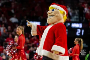 Nebraska Cornhuskers mascot Herbie Husker wearing a Santa outfit during a college basketball game against the North Dakota Fighting Hawks Wednesday, December 20, 2023, in Lincoln, Nebraska. Photo by John S. Peterson.