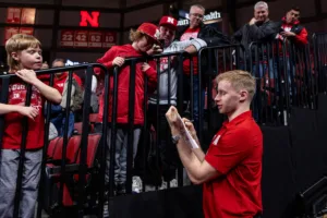 Nebraska Cornhusker forward Rienk Mast signs autographs for the kids after the win over the South Carolina State Bulldogs during a college basketball game on Friday, December 29, 2023, in Lincoln, Nebraska. Photo by John S. Peterson.