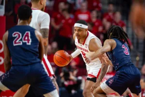Nebraska Cornhusker guard Jarron Coleman (9) dribbles the ball against South Carolina State Bulldog guard Michael Teal (3) in the second half during a college basketball game on Friday, December 29, 2023, in Lincoln, Nebraska. Photo by John S. Peterson.