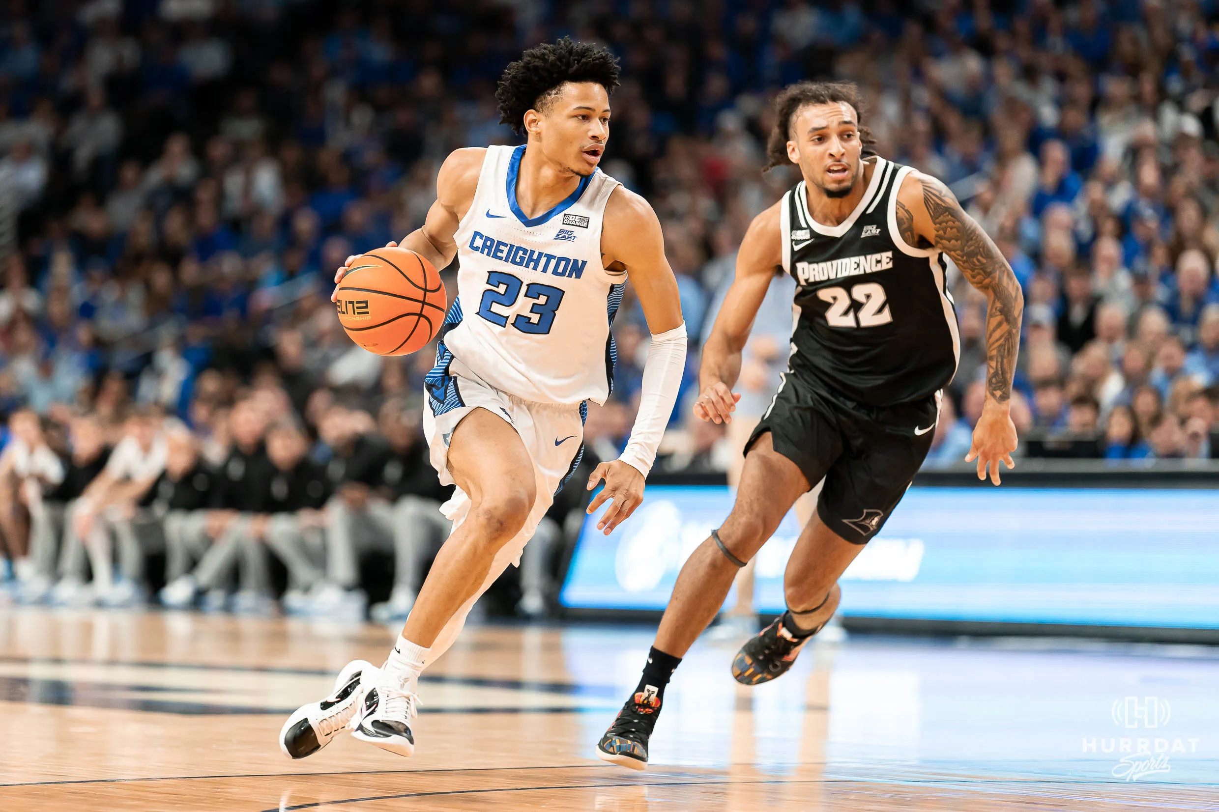 Creighton Bluejays guard Trey Alexander #23 drives to the basket past Providence Friars guard Devin Carter #22 during at the CHI Health Center in Omaha, NE January 6rth 2024. Photo by Eric Francis