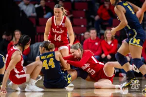 Nebraska Cornhusker guard Kendall Moriarty (15) fights for the ball against Michigan Wolverine forward Cameron Williams (44) in the firs half during a college basketball game on Wednesday, January 17, 2024, in Lincoln, Nebraska. Photo by John S. Peterson.