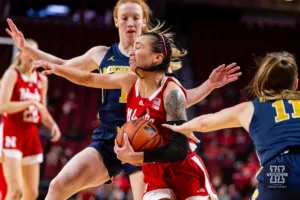 Nebraska Cornhusker guard Darian White (0) drives to the basket against Michigan Wolverine guard Lauren Hansen (1) in the first half during a college basketball game on Wednesday, January 17, 2024, in Lincoln, Nebraska. Photo by John S. Peterson.