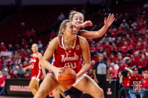 Nebraska Cornhusker center Alexis Markowski (40) drives to the basket against Michigan Wolverine guard Jordan Hobbs (10) in the second half during a college basketball game on Wednesday, January 17, 2024, in Lincoln, Nebraska. Photo by John S. Peterson.
