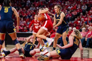 Nebraska Cornhusker guard Jaz Shelley (1) fights for the ball against Michigan Wolverine guard Lauren Hansen (1) and guard Elise Stuck (30) in the second half during a college basketball game on Wednesday, January 17, 2024, in Lincoln, Nebraska. Photo by John S. Peterson.
