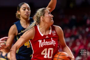 Nebraska Cornhusker center Alexis Markowski (40) makes a lay up against Michigan Wolverine forward Cameron Williams (44) in the second half during a college basketball game on Wednesday, January 17, 2024, in Lincoln, Nebraska. Photo by John S. Peterson.