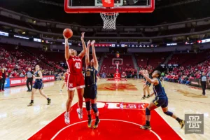 Nebraska Cornhusker center Alexis Markowski (40) makes a lay up against Michigan Wolverine guard Jordan Hobbs (10) in the second half during a college basketball game on Wednesday, January 17, 2024, in Lincoln, Nebraska. Photo by John S. Peterson.