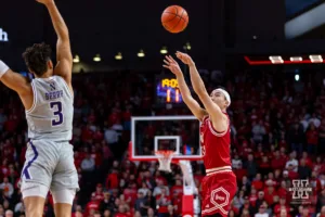 Nebraska Cornhusker guard Keisei Tominaga (30) makes a three point shot against Northwestern Wildcat guard Ty Berry (3) in the first half during a college basketball game on Saturday, January 20, 2024, in Lincoln, Nebraska. Photo by John S. Peterson.