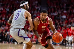 Nebraska Cornhusker guard Jamarques Lawrence (10) dribbles the ball against Northwestern Wildcat guard Boo Buie (0) in the first half during a college basketball game on Saturday, January 20, 2024, in Lincoln, Nebraska. Photo by John S. Peterson.