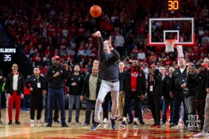 Former Nebraska basketball play Eric Piatkowski makes a half court shot at halftime during a college basketball game against the Northwestern Wildcats on Saturday, January 20, 2024, in Lincoln, Nebraska. Photo by John S. Peterson.