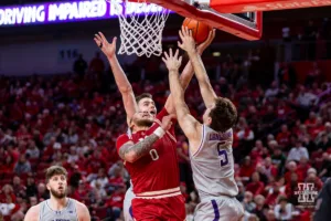 Nebraska Cornhusker guard C.J. Wilcher (0) tries for a lay up against Northwestern Wildcat guard Ryan Langborg (5) in the second half during a college basketball game on Saturday, January 20, 2024, in Lincoln, Nebraska. Photo by John S. Peterson.