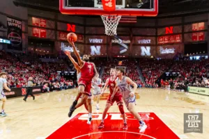Nebraska Cornhusker guard Brice Williams (3) makes a lay up against Northwestern Wildcat forward Luke Hunger (33) in the first half during a college basketball game on Saturday, January 20, 2024, in Lincoln, Nebraska. Photo by John S. Peterson.