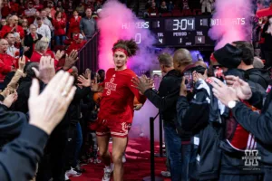 Nebraska Cornhusker forward Josiah Allick (53) leads the Huskers out with the alumni team giving them fives before taking on the Northwestern Wildcats during a college basketball game on Saturday, January 20, 2024, in Lincoln, Nebraska. Photo by John S. Peterson.
