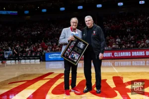 Former Nebraska basketball coach Danny Nee is recognized by Kent Pavelka during a college basketball game against the Northwestern Wildcats on Saturday, January 20, 2024, in Lincoln, Nebraska. Photo by John S. Peterson.