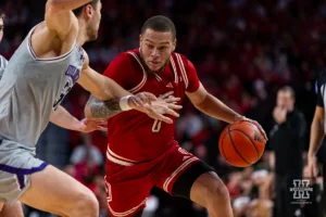 Nebraska Cornhusker guard C.J. Wilcher (0) drives to the lane against Northwestern Wildcat forward Luke Hunger (33) in the second half during a college basketball game on Saturday, January 20, 2024, in Lincoln, Nebraska. Photo by John S. Peterson.