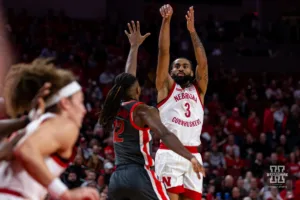 Nebraska Cornhusker guard Brice Williams (3) sinks a three against Ohio State Buckeye guard Evan Mahaffey (12) in the first half during a college basketball game on Tuesday, January 23, 2024, in Lincoln, Nebraska. Photo by John S. Peterson.