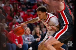 Nebraska Cornhusker guard Eli Rice (11) dribbles the ball against Ohio State Buckeye forward Jamison Battle (10) in the first half during a college basketball game on Tuesday, January 23, 2024, in Lincoln, Nebraska. Photo by John S. Peterson.