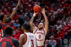 Nebraska Cornhusker guard C.J. Wilcher (0) makes a three point shot against the Ohio State Buckeyes in the second half during a college basketball game on Tuesday, January 23, 2024, in Lincoln, Nebraska. Photo by John S. Peterson.
