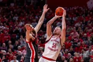 Nebraska Cornhusker forward Rienk Mast (51) makes a three point shot against Ohio State Buckeye forward Jamison Battle (10) in the second half during a college basketball game on Tuesday, January 23, 2024, in Lincoln, Nebraska. Photo by John S. Peterson.