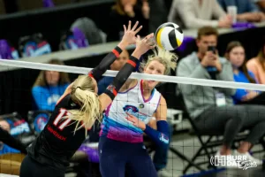 Omaha Supernovas Jess Schaben-Lansman (10) spikes the ball around Atlanta Vibe Alli Linnehan (17) during the first professional volleyball match in the United States on Wednesday, January 24, 2024, in Omaha, Nebraska. Photo by John S. Peterson.