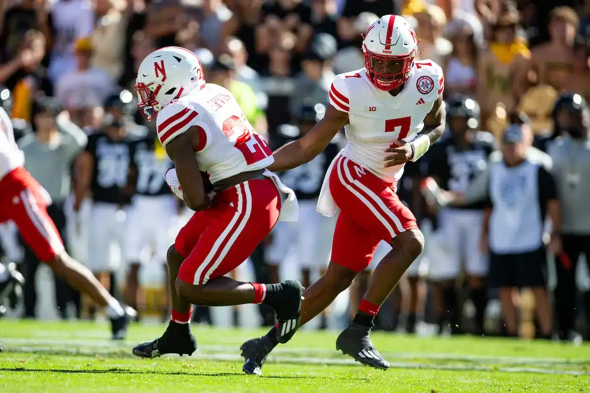 Jeff Sims (7) quarterback of the Nebraska Cornhuskers hands the ball off to Gabe Ervin Jr. (22) running back of the Nebraska Cornhuskers in the first quarter against the Colorado Buffaloes during a college football game in Boulder, Colorado, Friday, September 9, 2023. Photo by John Peterson.