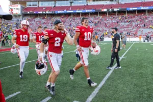 Nebraska Cornhuskers Heinrich Haarberg (10) and Isaac Gifford (2) walk off the field after the loss to the Michigan Wolverines during a college football game in Lincoln, Nebraska, Saturday, September 30, 2023. Photo by John Peterson.