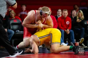 Nebraska Cornhusker Nash Hutmacher tightens up his hold against the Wyoming Cowboys during a college wrestling match on Saturday, January 6, 2024, in Lincoln, Nebraska. Photo by John S. Peterson.