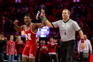 Nebraska Cornhusker Antrell Taylor celebrates his decision over Northern Iowa Panther RJ Weston during a college wrestling match on Saturday, January 6, 2024, in Lincoln, Nebraska. Photo by John S. Peterson.