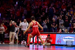 Nebraska Cornhusker Silas Allred celebrates his pin against Northern Iowa Panther Wyatt Voelker during a college wrestling match on Saturday, January 6, 2024, in Lincoln, Nebraska. Photo by John S. Peterson.