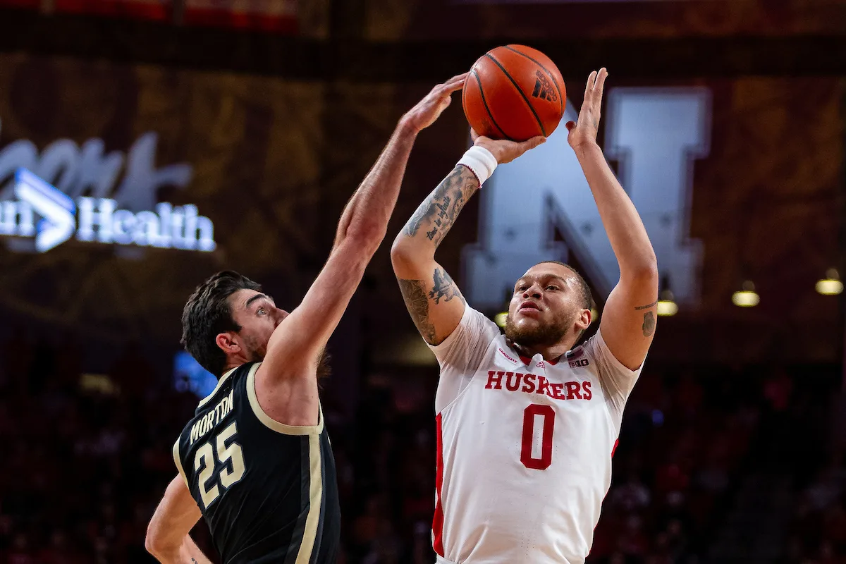 Nebraska Cornhusker guard C.J. Wilcher (0) makes a three point shot against Purdue Boilermaker guard Ethan Morton (25) in the first half during a college basketball game on January 9, 2024, in Lincoln, Nebraska. Photo by John S. Peterson.