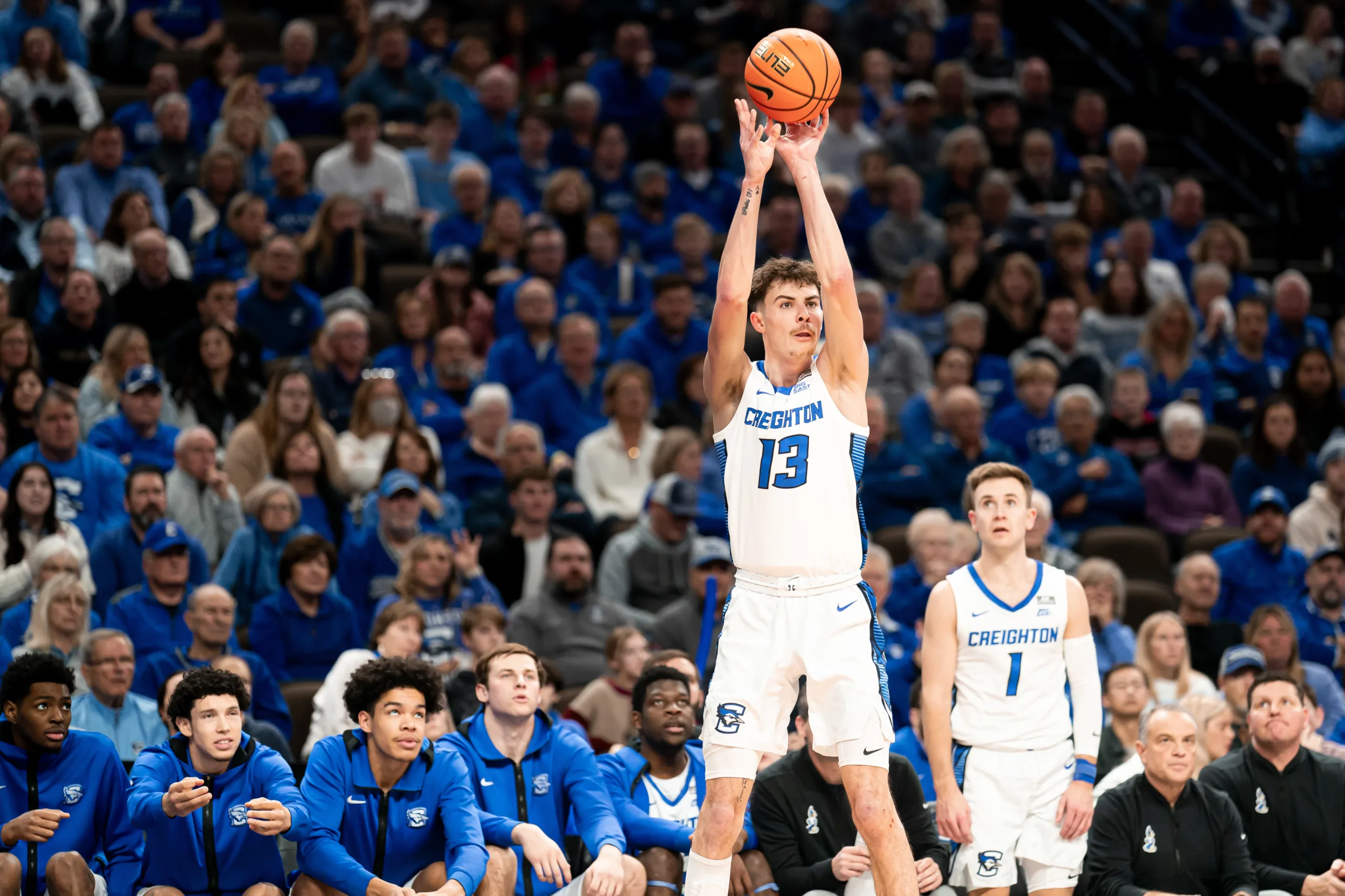 Creighton Bluejays forward Mason Miller #13 shoots the ball against the Providence Friars during a game at the CHI Health Center in Omaha, NE January 6rth 2024. Photo by Eric Francis