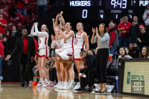 Nebraska Cornhuskers celebrate the first basket against the Purdue Boilermakers during a college basketball game on Wednesday, January 31, 2024, in Lincoln, Nebraska. Photo by John S. Peterson.