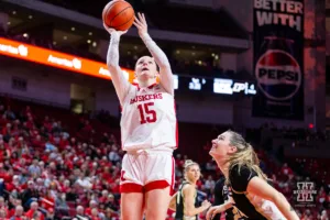 Nebraska Cornhusker guard Kendall Moriarty (15) makes a basket against Purdue Boilermaker forward Caitlyn Harper (34) in the first half during a college basketball game on Wednesday, January 31, 2024, in Lincoln, Nebraska. Photo by John S. Peterson.