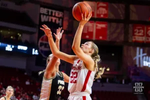 Nebraska Cornhusker forward Natalie Potts (22) makes a lay up against Purdue Boilermaker guard Madison Layden (33) in the first half during a college basketball game on Wednesday, January 31, 2024, in Lincoln, Nebraska. Photo by John S. Peterson.