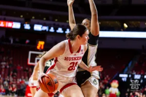 Nebraska Cornhusker forward Annika Stewart (21) dribbles along the baseline against the Purdue Boilermakers in the second half during a college basketball game on Wednesday, January 31, 2024, in Lincoln, Nebraska. Photo by John S. Peterson.