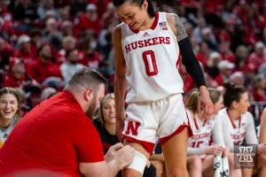 Nebraska Cornhusker guard Darian White (0) gets taped up after getting a cut on her leg against the Purdue Boilermakers in the second half during a college basketball game on Wednesday, January 31, 2024, in Lincoln, Nebraska. Photo by John S. Peterson.