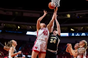 Nebraska Cornhusker center Alexis Markowski (40) reaches for the rebound against Purdue Boilermaker forward Caitlyn Harper (34) in the second half during a college basketball game on Wednesday, January 31, 2024, in Lincoln, Nebraska. Photo by John S. Peterson.