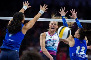 Omaha Supernovas Brooke Nuneviller (5) spikes the ball against San Diego Mojo Ronika Stone (7) and Nootsara Tomkom (13) in the first period during a professional volleyball match on Saturday, February 3, 2024, in Omaha, Nebraska. Photo by John S. Peterson.