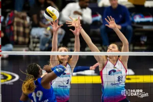Omaha Supernovas Sydney Hilley (2) and Danielle Hart (81) jump to block a shot from San Diego Mojo Temi Thomas-Ailara (19) in the second set during a professional volleyball match on Saturday, February 3, 2024, in Omaha, Nebraska. Photo by John S. Peterson.