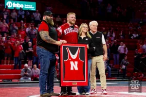 Nebraska Corhusker Nash Hutmacher poses for a photo for Senior Night during a college wrestling match against the Michigan Wolverines on Friday, February 9, 2024, in Lincoln, Nebraska. Photo by John S. Peterson.
