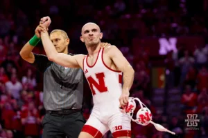 Nebraska Cornhusker No. 7 Brock Hardy (13-5) has his hand held up for the win over Michigan Wolverine No. 4 Dylan Ragusin (20-0) during a college wrestling match on Friday, February 9, 2024, in Lincoln, Nebraska. Photo by John S. Peterson.