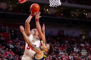 Nebraska Cornhusker forward Josiah Allick (53) makes a lay up against Michigan Wolverine forward Terrance Williams II (5) in the first half during a college basketball game on Saturday, February 10, 2024, in Lincoln, Nebraska. Photo by John S. Peterson.