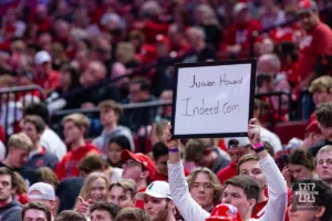 Nebraska Cornhusker student holds a sign for Michigan Wolverine head coach Juwan Howard during a college basketball game on Saturday, February 10, 2024, in Lincoln, Nebraska. Photo by John S. Peterson.