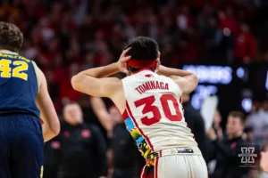 Nebraska Cornhusker guard Keisei Tominaga (30) celebrates making a three point shot against the Michigan Wolverines in the first half during a college basketball game on Saturday, February 10, 2024, in Lincoln, Nebraska. Photo by John S. Peterson.