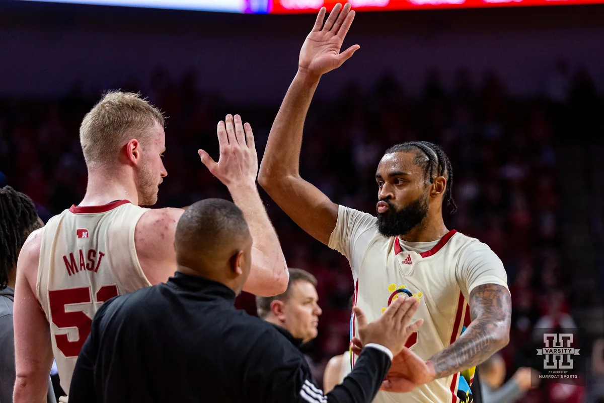 Nebraska Cornhusker guard Brice Williams (3) gives a high five to forward Rienk Mast (51) in the second half against the Michigan Wolverines during a college basketball game on Saturday, February 10, 2024, in Lincoln, Nebraska. Photo by John S. Peterson.