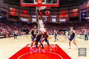 Nebraska Cornhusker forward Juwan Gary (4) makes a dunk in the first half against the Michigan Wolverines during a college basketball game on Saturday, February 10, 2024, in Lincoln, Nebraska. Photo by John S. Peterson.