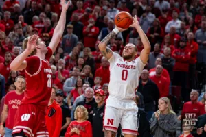 Nebraska Cornhusker guard C.J. Wilcher (0) makes a three point shot against Wisconsin Badger forward Steven Crowl (22) in the second half during a college basketball game on Thursday, February 1, 2024, in Lincoln, Nebraska. Photo by John S. Peterson.