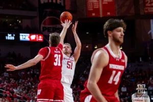Nebraska Cornhusker forward Rienk Mast (51) makes a three point shot against Wisconsin Badger forward Nolan Winter (31) in the first half during a college basketball game on Thursday, February 1, 2024, in Lincoln, Nebraska. Photo by John S. Peterson.