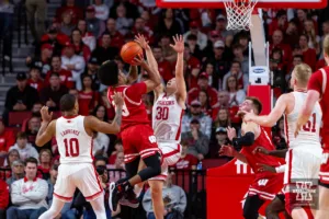 Wisconsin Badger guard Chucky Hepburn (23) tries to make a shot over Nebraska Cornhusker guard Keisei Tominaga (30) in the first half during a college basketball game on Thursday, February 1, 2024, in Lincoln, Nebraska. Photo by John S. Peterson.